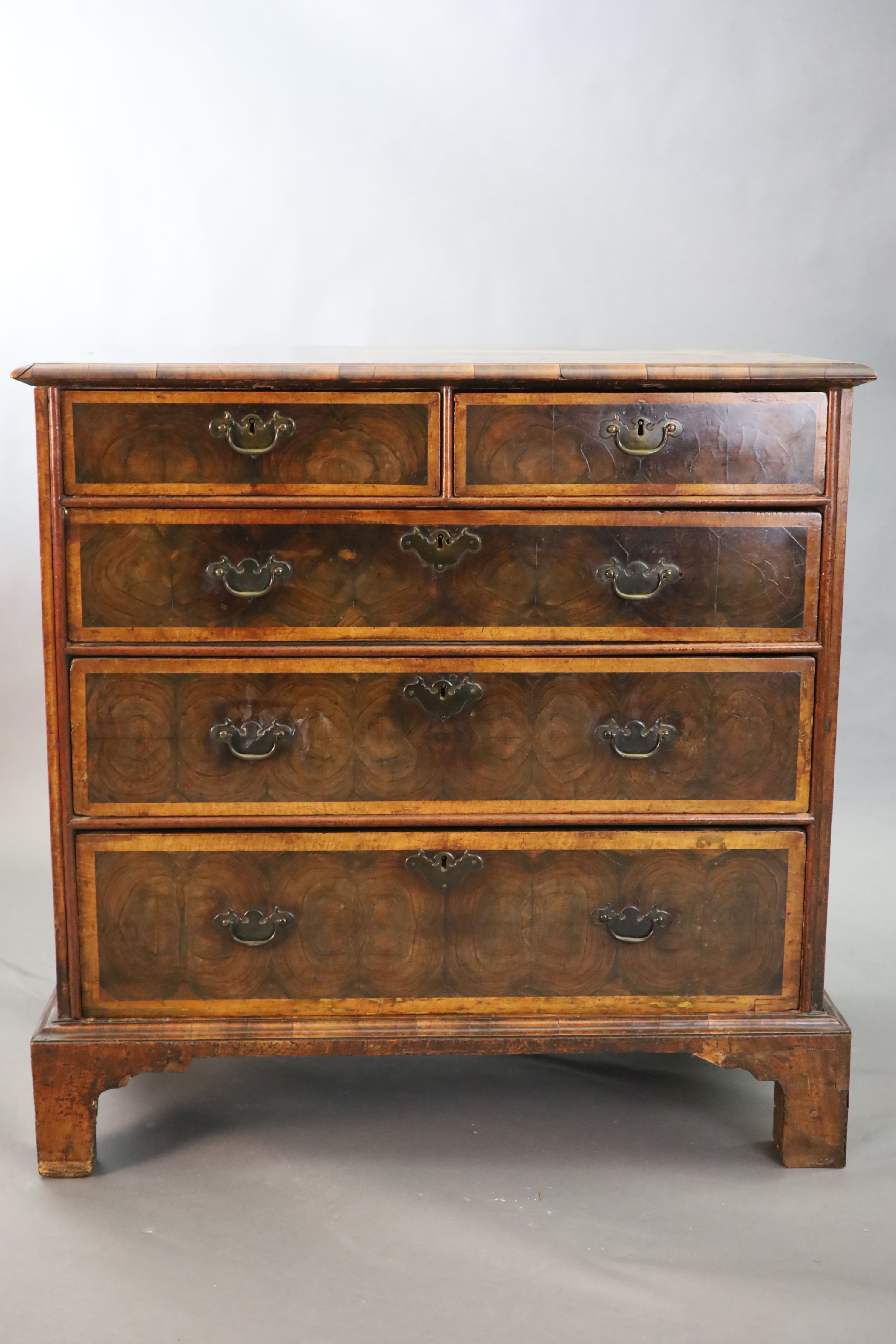 An early 18th century oyster veneered chest, W.3ft .5in. D.1ft 10in. H.3ft 1in.